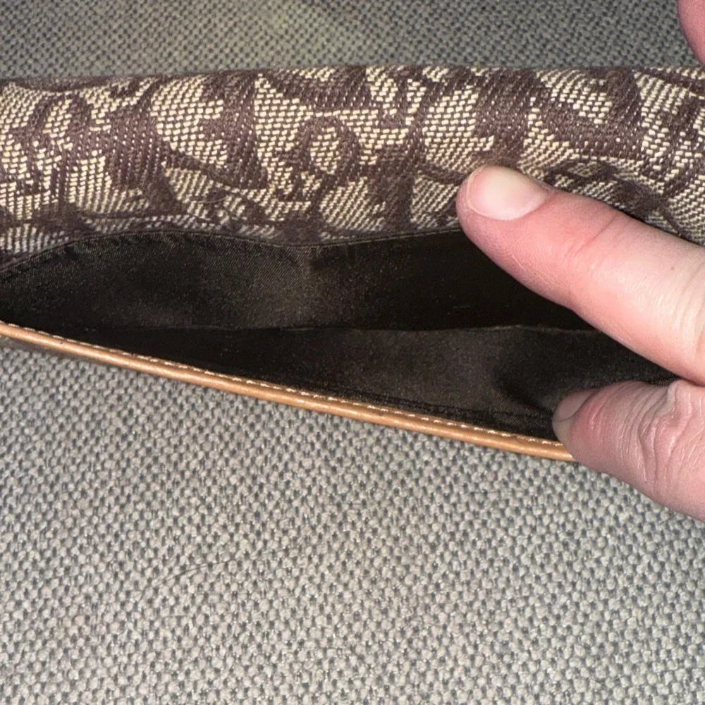 Dior Tan and Brown Monogram Wallet with snap clip close pouch.